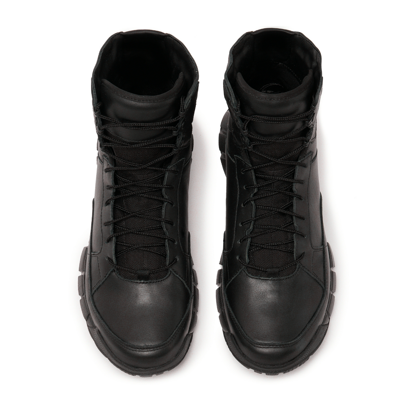 Pair of black Oakley boots on a white background