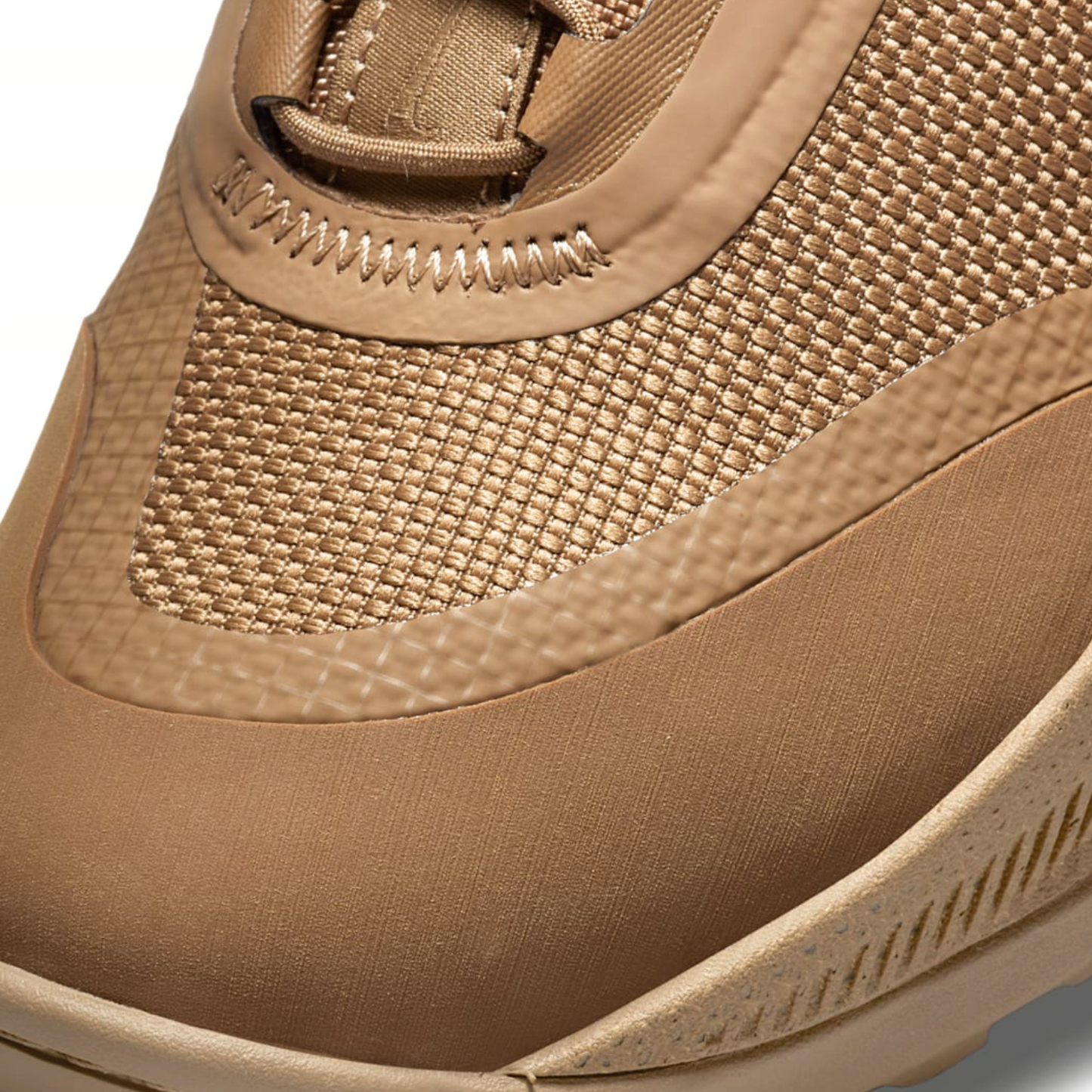 Close-up macro view of the mesh upper and reinforced stitching on the Nike React SFB Carbon Mid Coyote Tactical Boots.