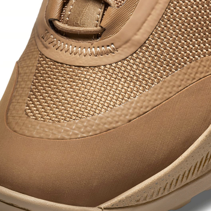 Close-up macro view of the mesh upper and reinforced stitching on the Nike React SFB Carbon Mid Coyote Tactical Boots.