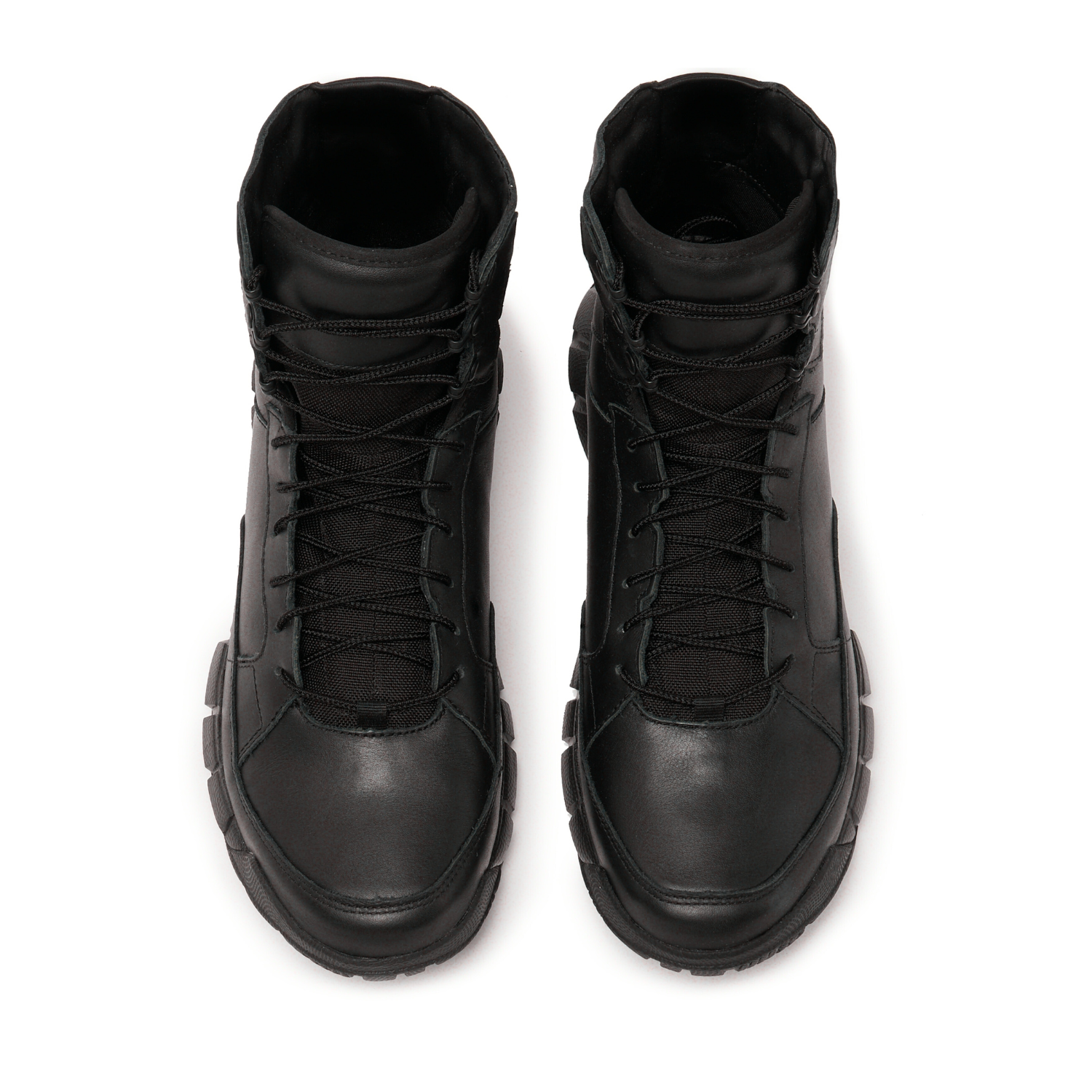 Pair of black Oakley boots on a white background